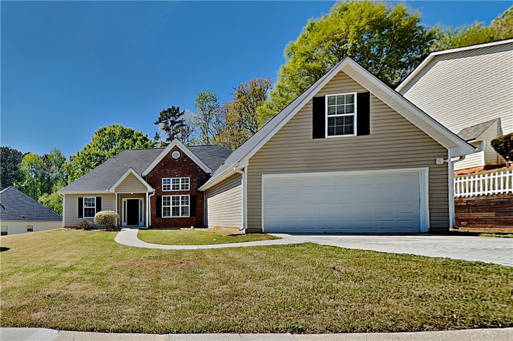 a view of a house with a yard
