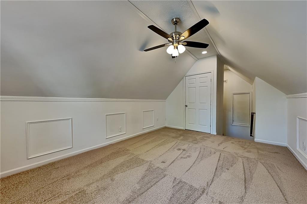 4206 Shoreside Circle Southwest Snellville, GA 30039 - Photo 15 of 20 a view of a big room with chandelier fan