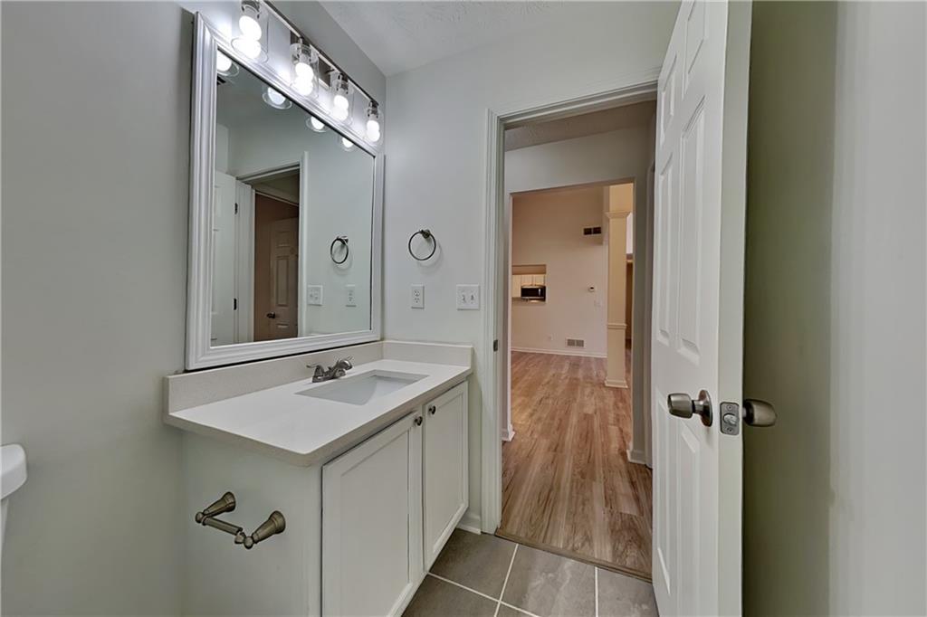 4206 Shoreside Circle Southwest Snellville, GA 30039 - Photo 16 of 20 a bathroom with a sink and mirror