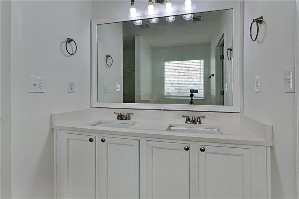 4206 Shoreside Circle Southwest Snellville, GA 30039 - Photo 9 of 20 a bathroom with a sink and a mirror