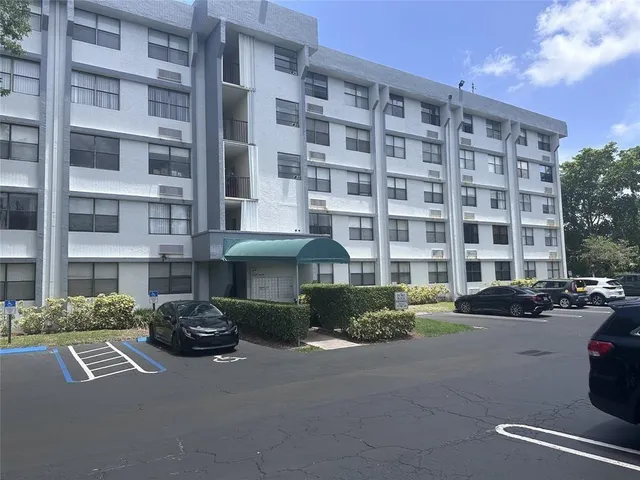 a front view of a building with street view