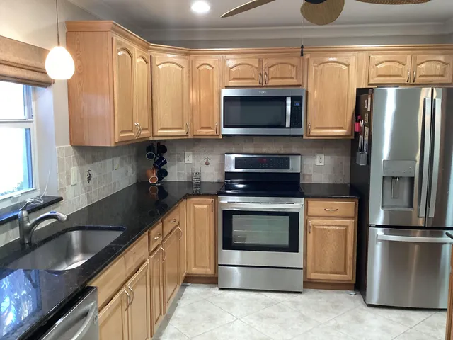 a bathroom with a shower a toilet and a sink