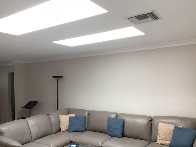 a bedroom with a bed and a lamp