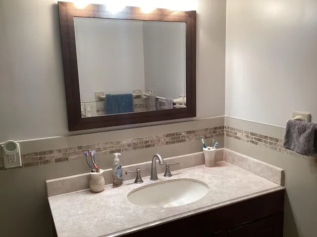 a living room with large windows and a table