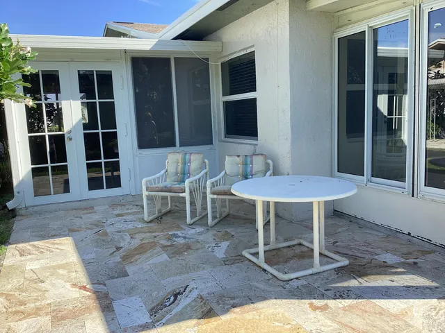 a kitchen with stainless steel appliances granite countertop a refrigerator stove and microwave