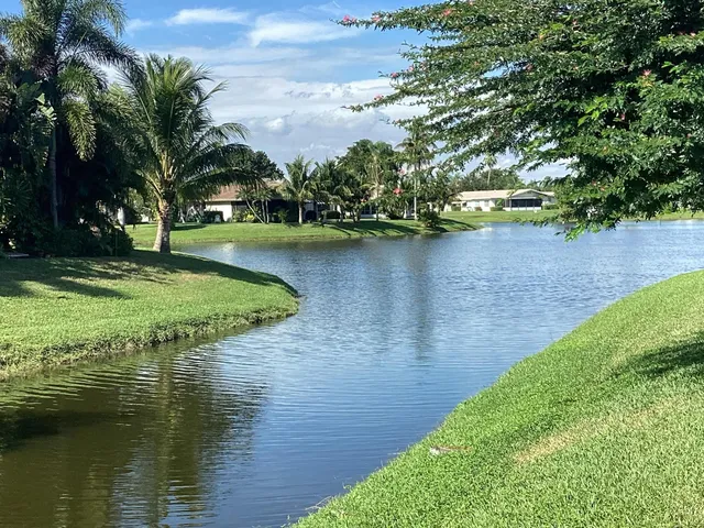 a living room with furniture and a lamp