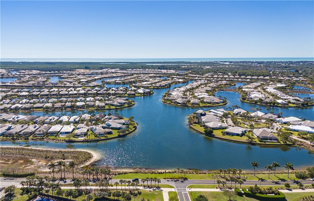 6466 Warwick Avenue Naples, FL 34113 - Photo 42 of 43 an aerial view of a building with outdoor seating
