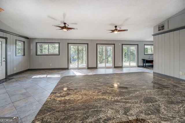 a living room with a couch and a flat screen tv