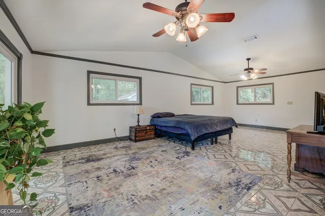 a bathroom with a granite countertop double vanity sink and a mirror