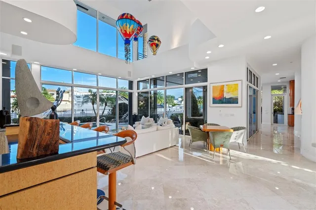 a very nice looking room with kitchen view and a large window