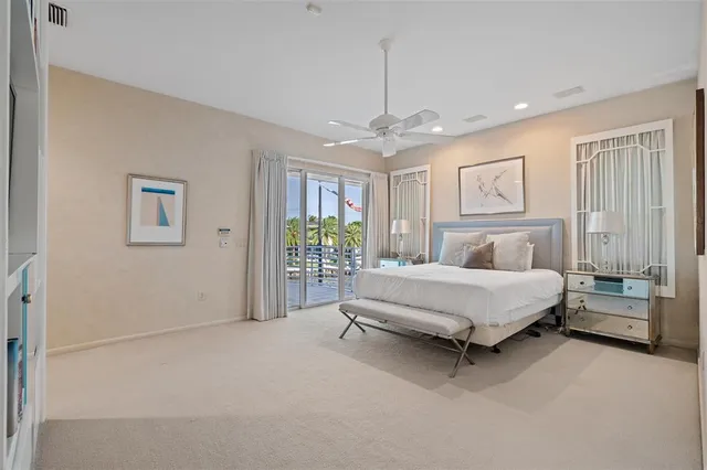 a bed room with a bed and a chandelier