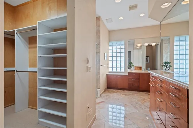 a large en suite bathroom with a tub sink and mirror