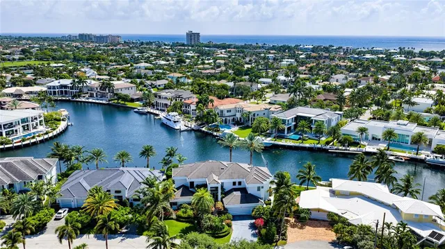 an aerial view of a city with lake view