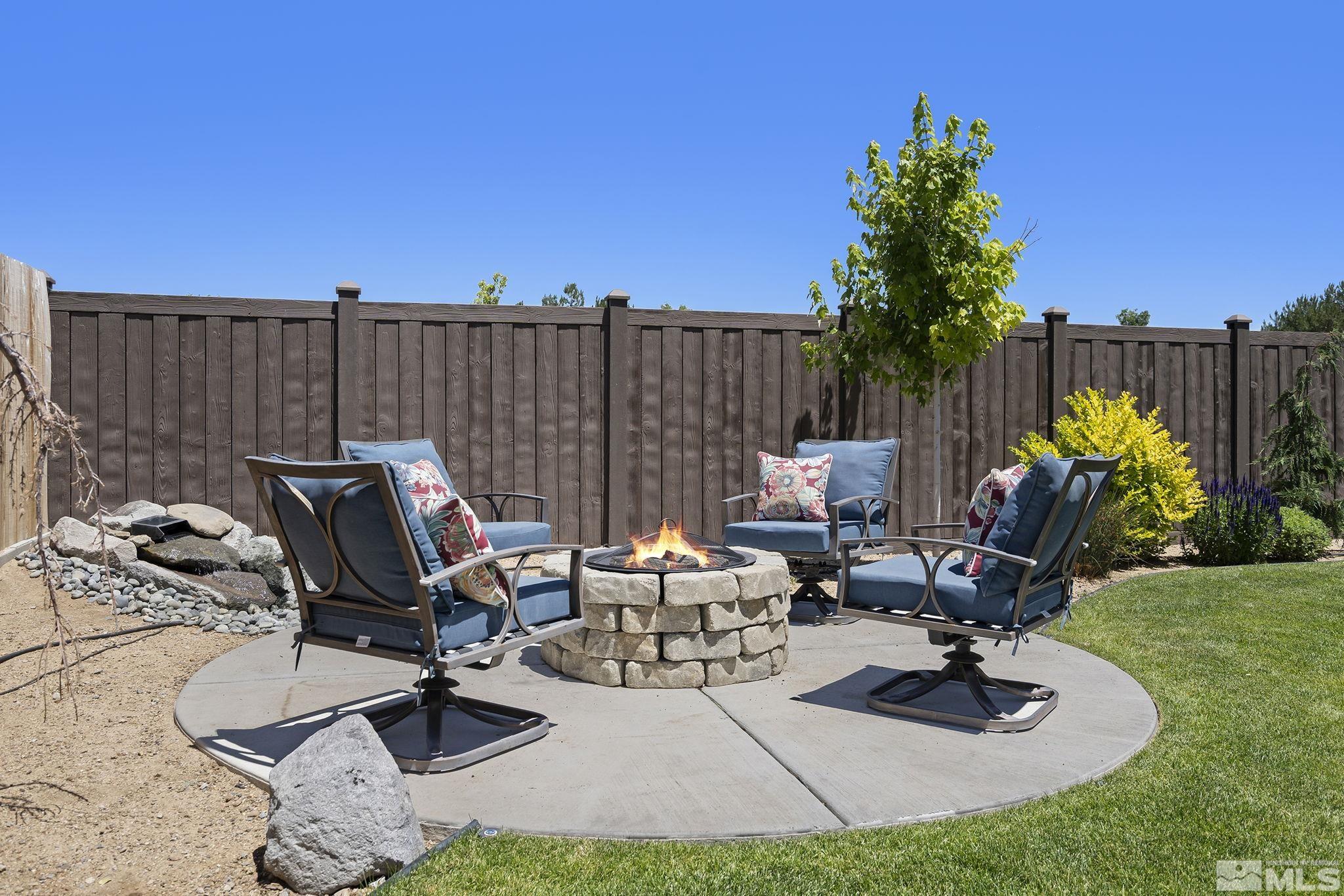 9166 Gulf Court Reno, NV 89506 - Photo 26 of 33 a view of a patio with chairs and plants