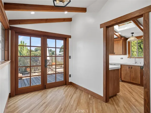 a kitchen with stainless steel appliances granite countertop a refrigerator a sink and a stove