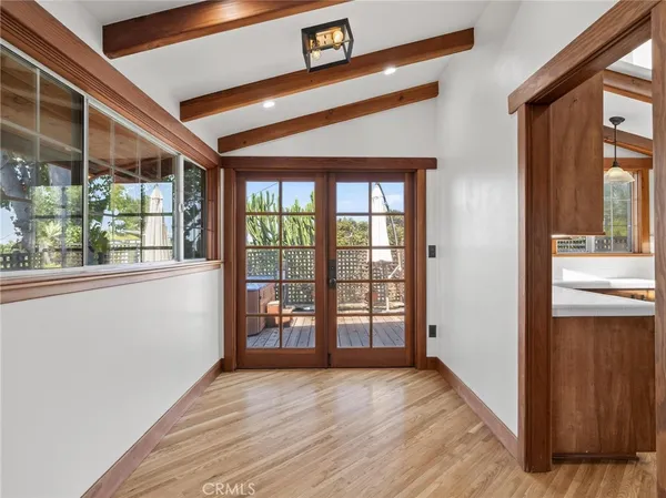 a view of a room with wooden floor