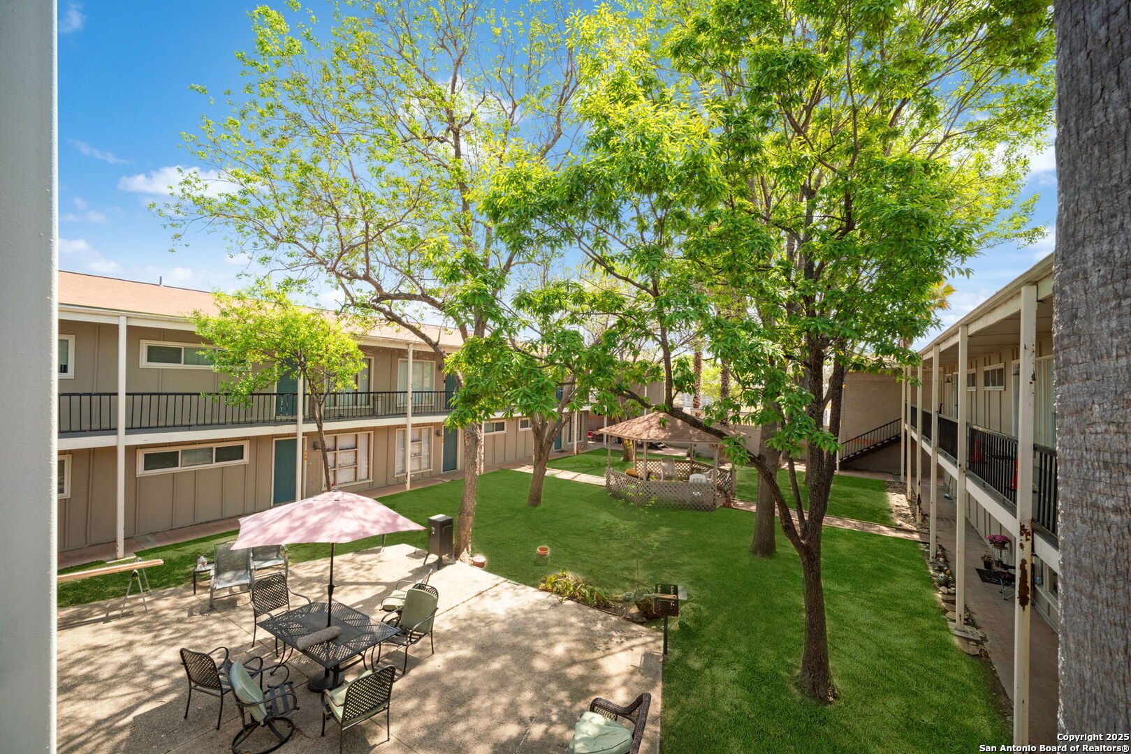 255 East Rampart Drive, Unit 211 San Antonio, TX 78216 - Photo 16 of 17 a view of a backyard