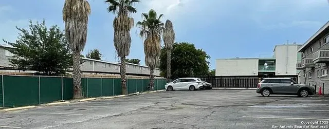 a view of a car parked in front of a house