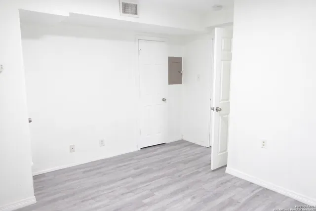 a view of a small space with wooden floor