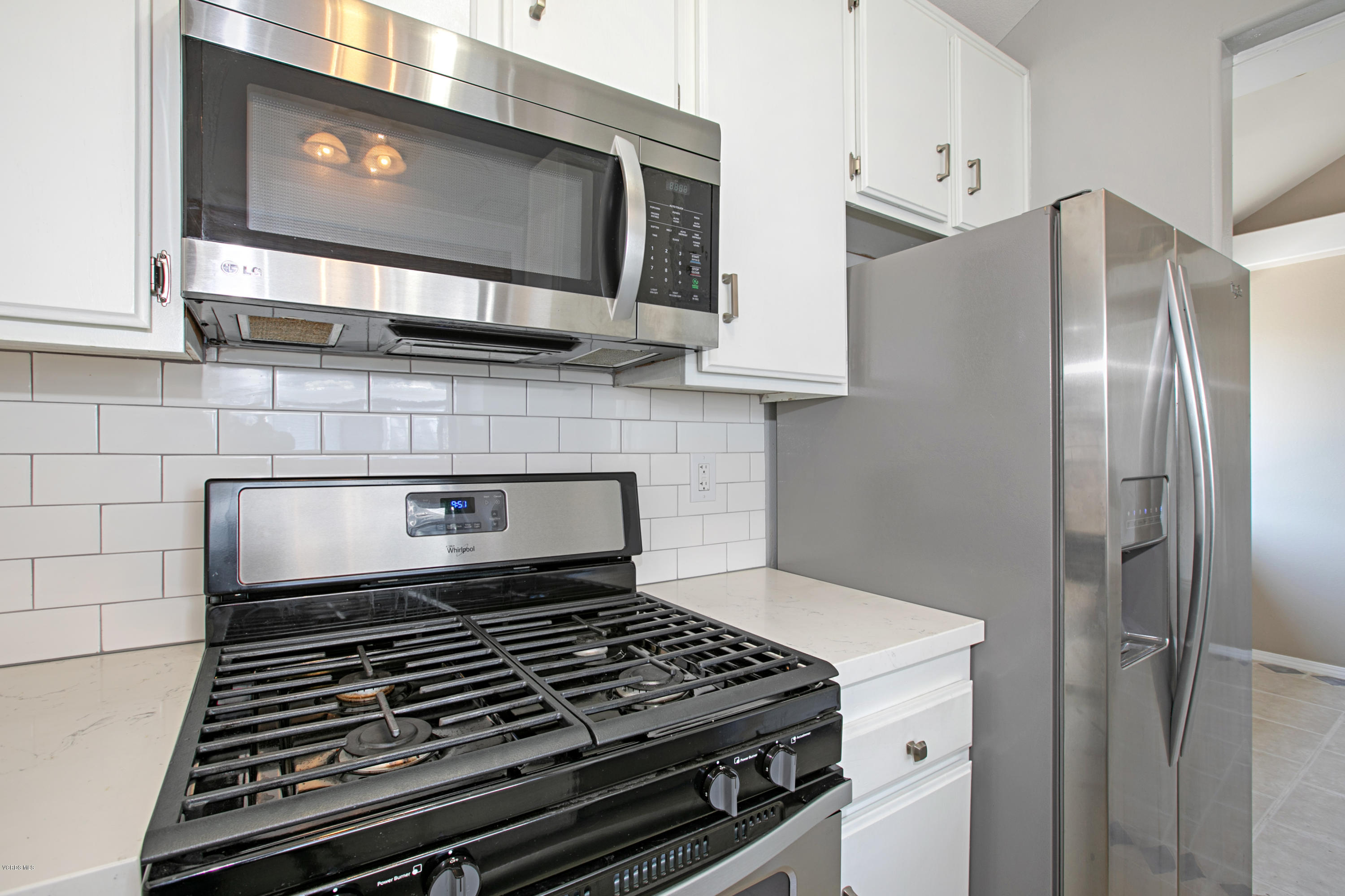 659 Arneill Road Camarillo, CA 93010 - Photo 11 of 25 a stove top oven sitting inside of a kitchen