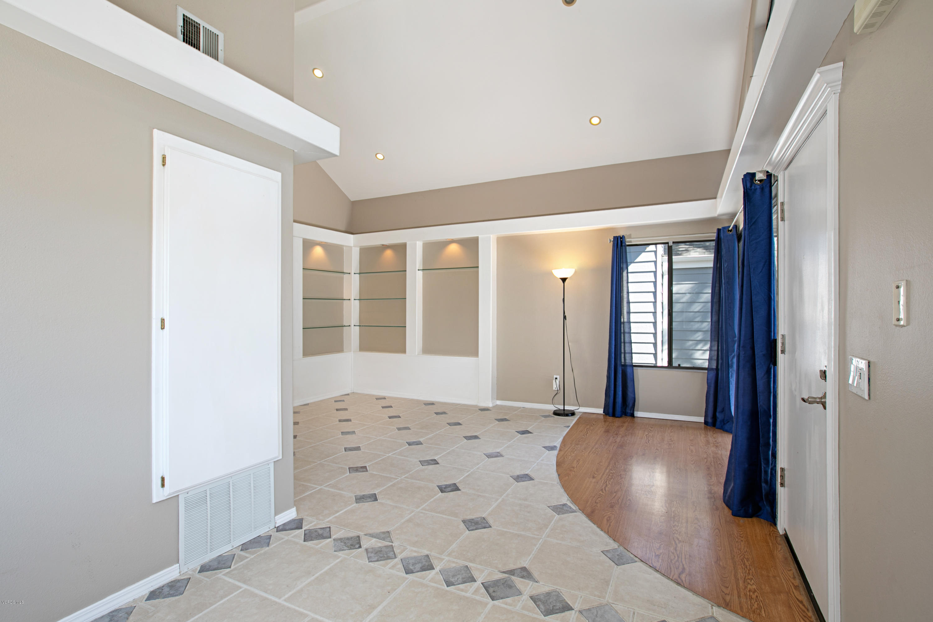 659 Arneill Road Camarillo, CA 93010 - Photo 14 of 25 a view of a bedroom with wooden floor and windows
