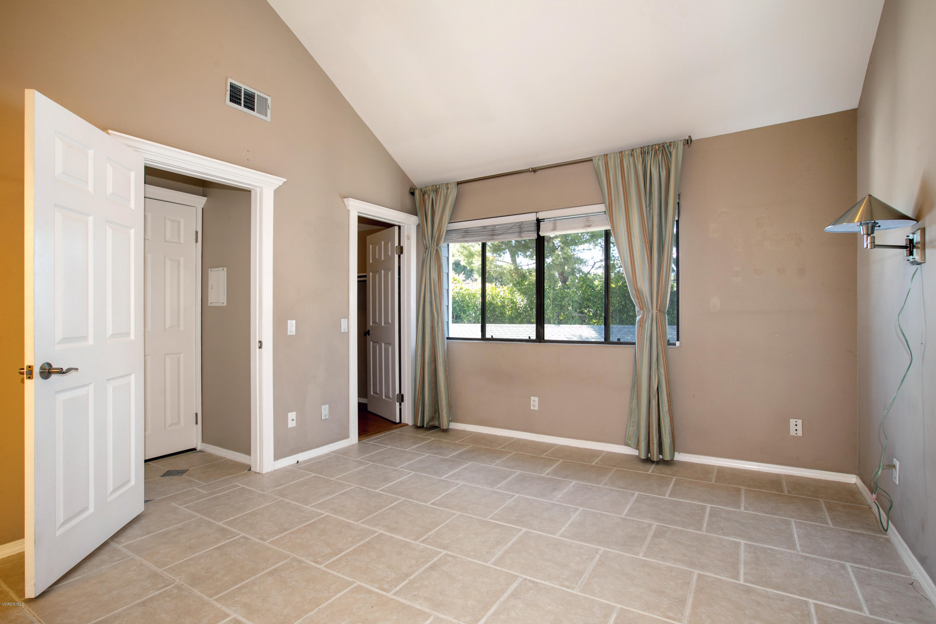 659 Arneill Road Camarillo, CA 93010 - Photo 17 of 25 a view of an empty room with a window