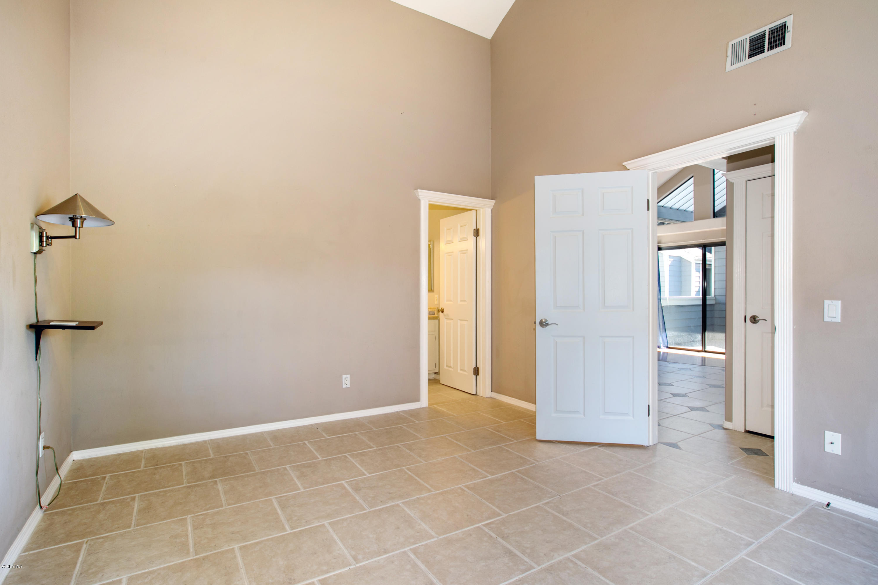 659 Arneill Road Camarillo, CA 93010 - Photo 19 of 25 a view of a hallway with closet and a bathroom