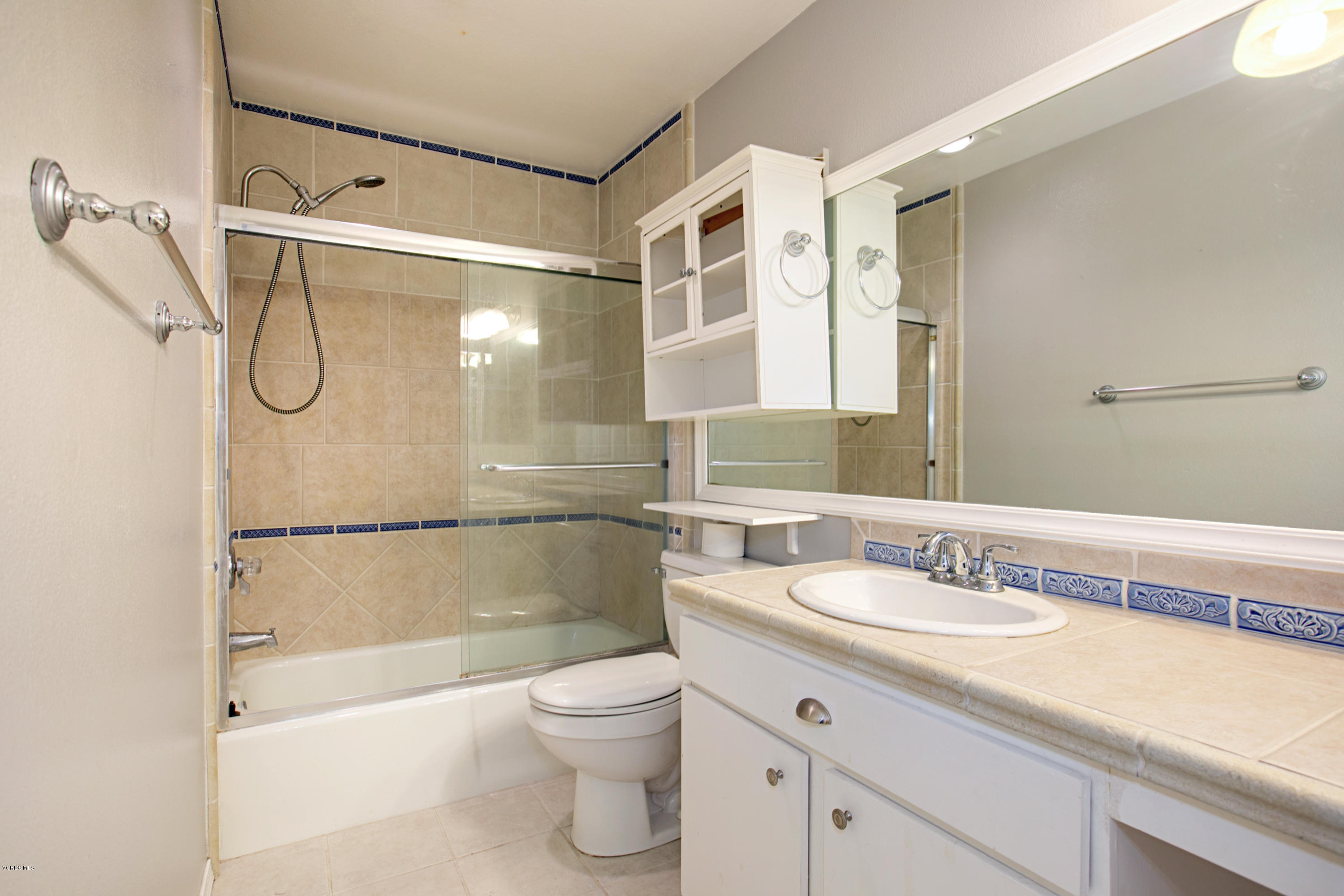 659 Arneill Road Camarillo, CA 93010 - Photo 20 of 25 a bathroom with a granite countertop sink mirror vanity and toilet