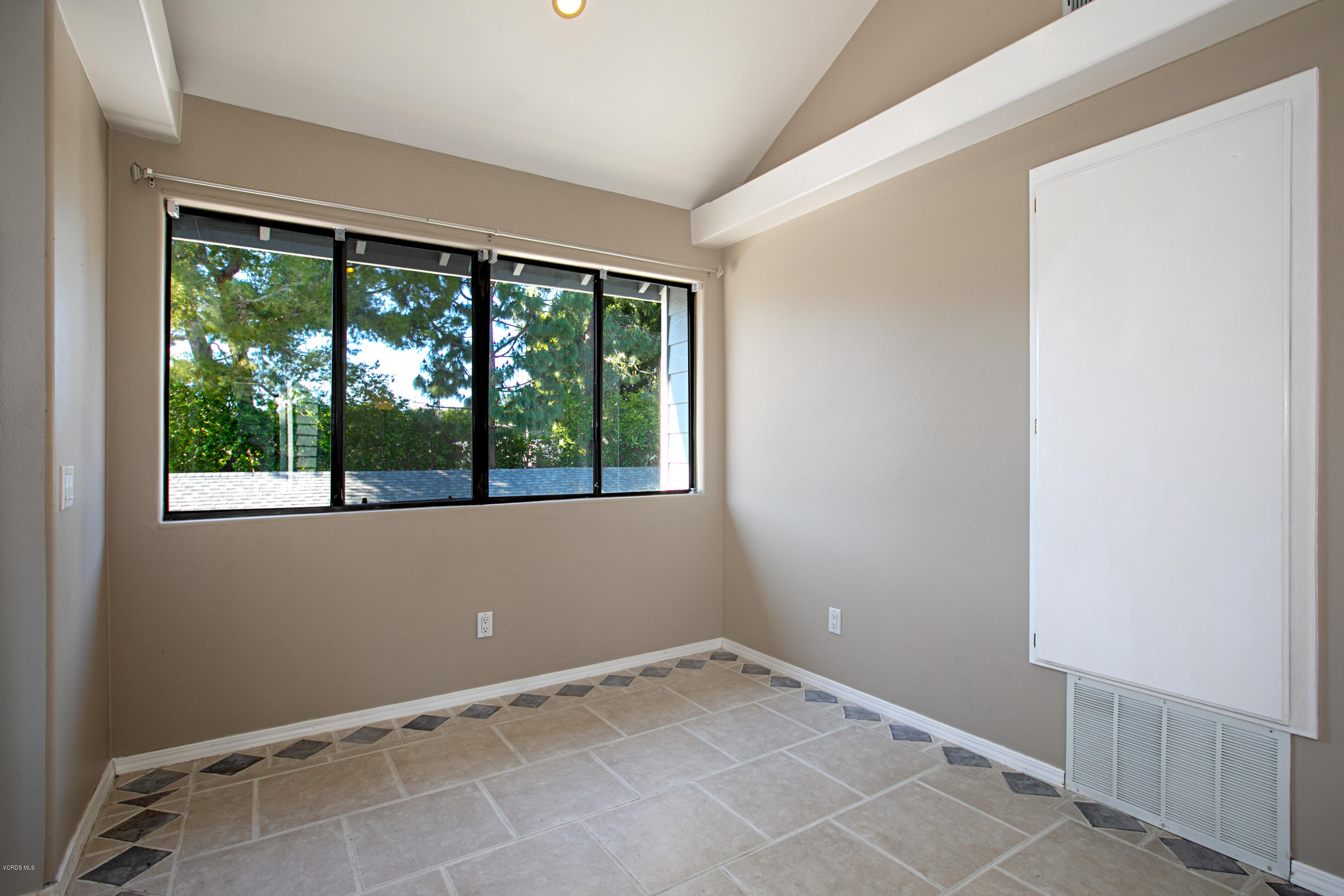 659 Arneill Road Camarillo, CA 93010 - Photo 5 of 25 a view of an empty room with a window