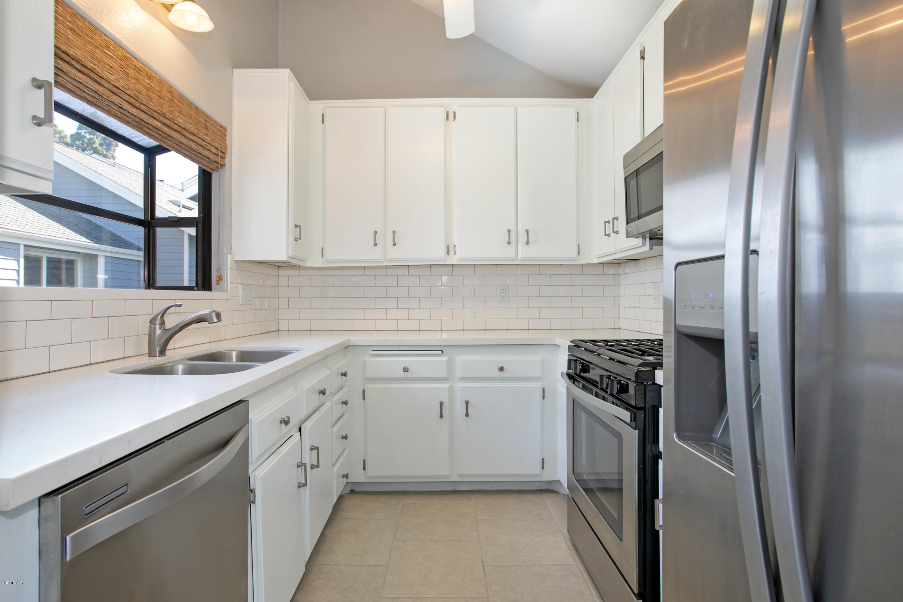 659 Arneill Road Camarillo, CA 93010 - Photo 7 of 25 a kitchen with stainless steel appliances granite countertop a sink stove and refrigerator