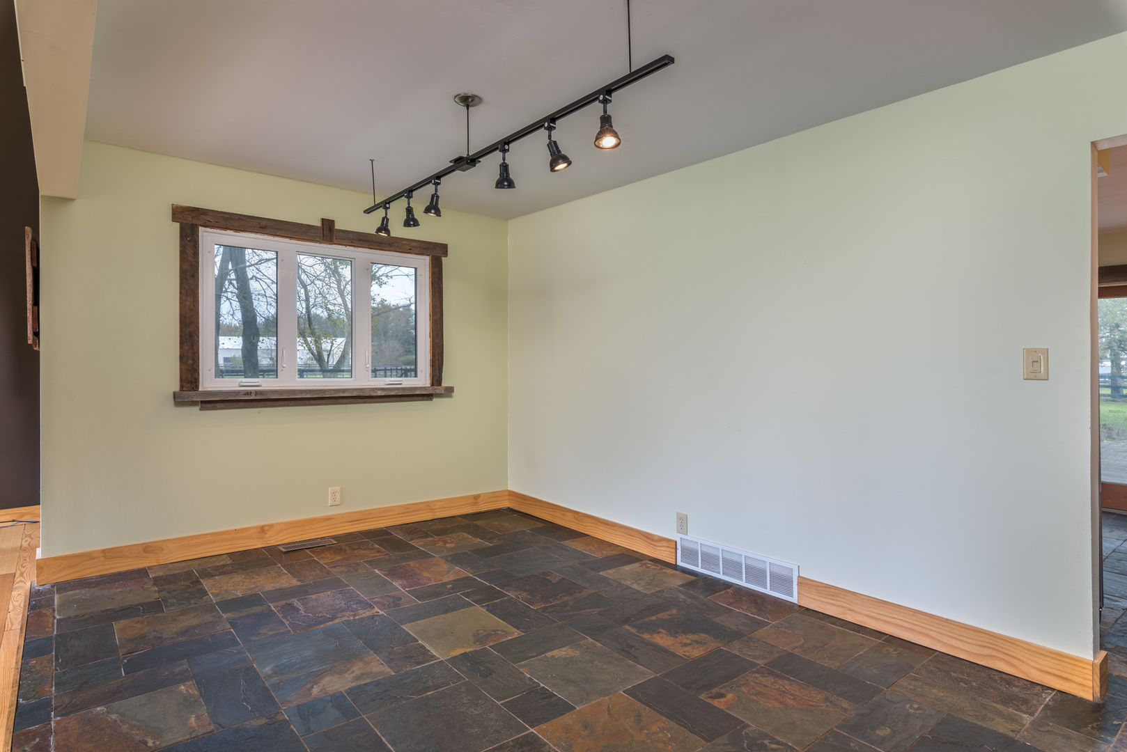40W977 Plank Road Elgin, IL 60124 - Photo 6 of 38 a view of a big room with wooden floor and windows