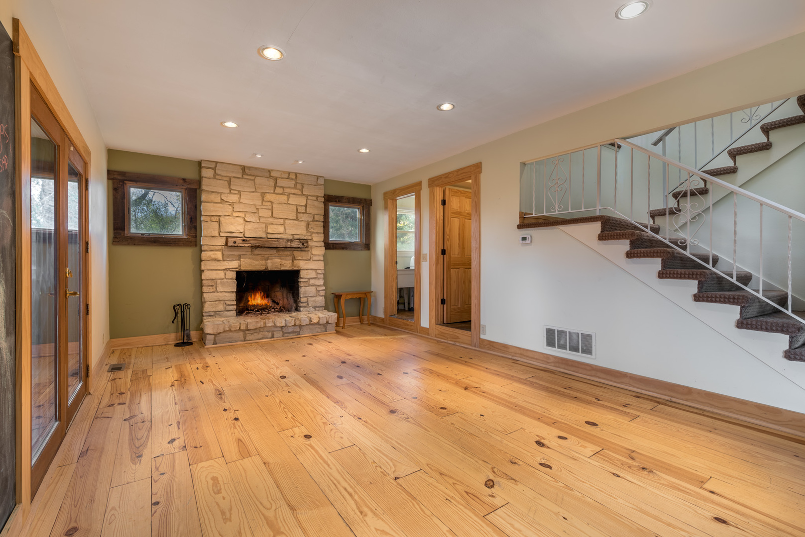 40W977 Plank Road Elgin, IL 60124 - Photo 8 of 38 a view of empty room with wooden floor and fireplace