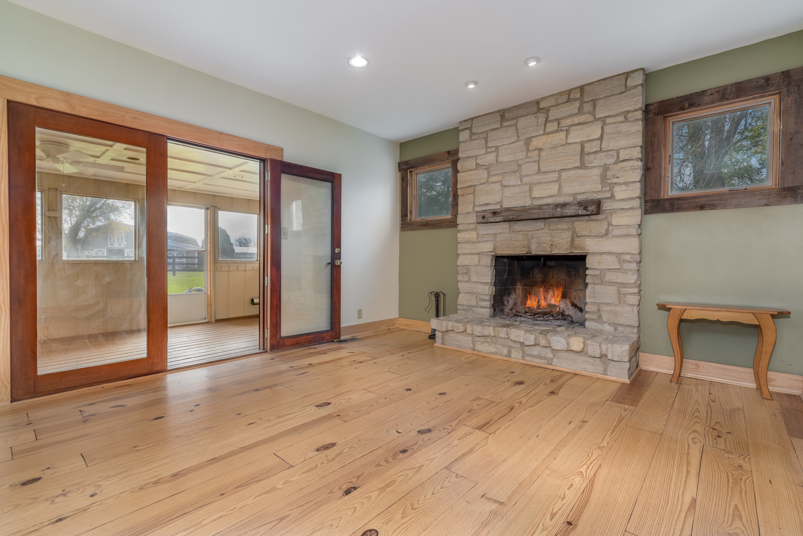 40W977 Plank Road Elgin, IL 60124 - Photo 9 of 38 a view of empty room with wooden floor and fireplace