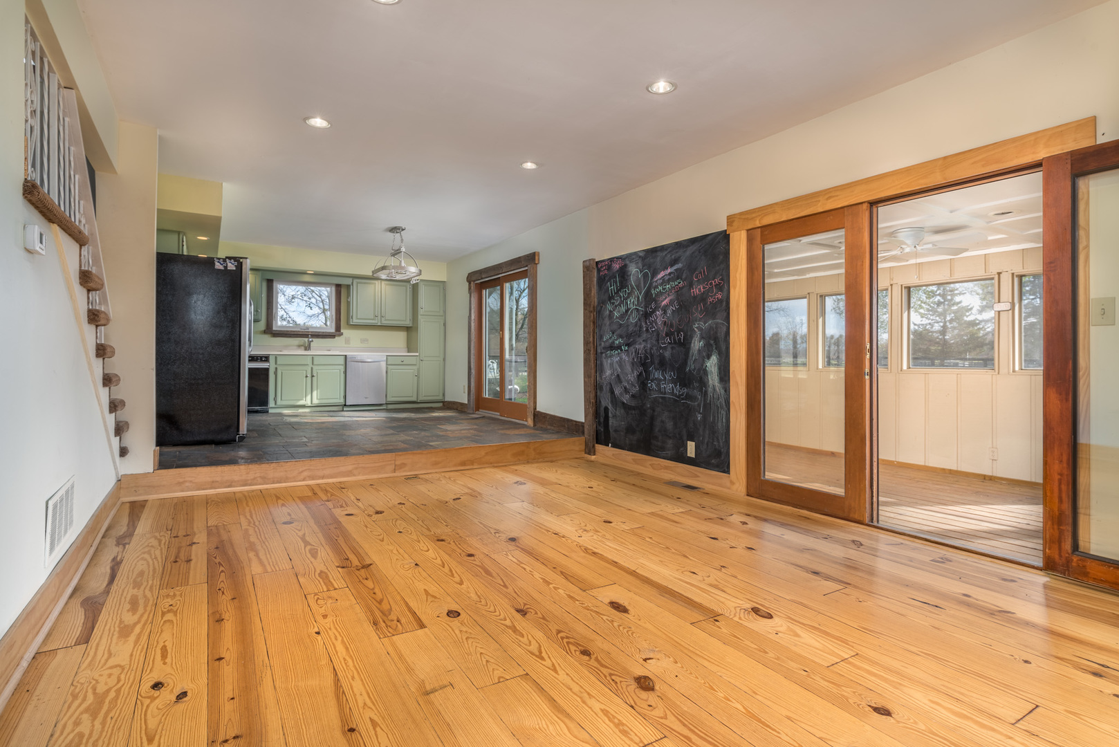 40W977 Plank Road Elgin, IL 60124 - Photo 10 of 38 a view of an empty room with wooden floor and a kitchen
