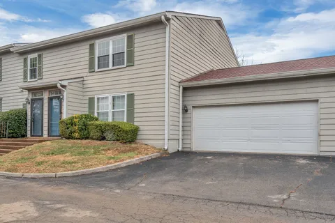 a view of house and garage