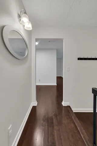 a view of a livingroom with wooden floor