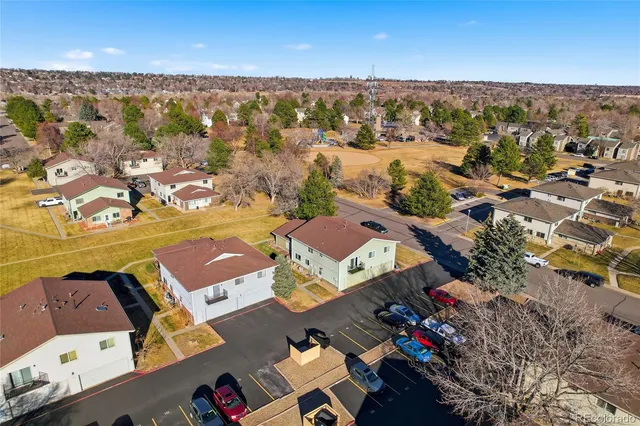 an aerial view of residential houses with outdoor space