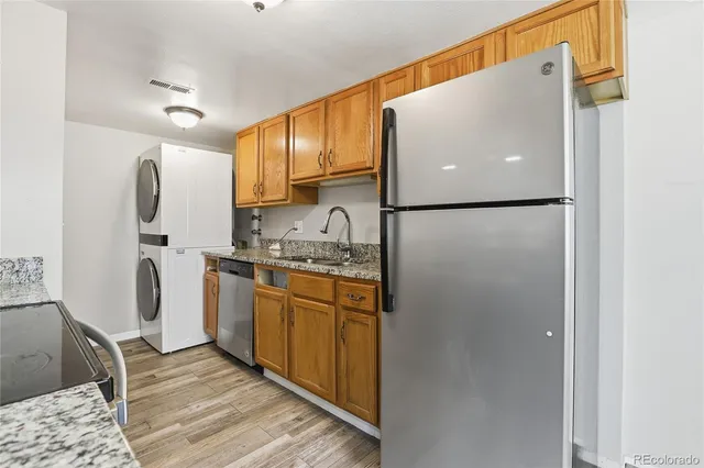 a white refrigerator freezer sitting inside of a kitchen