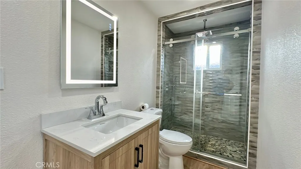 508 West Pear Street Compton, CA 90222 - Photo 12 of 14 a bathroom with a sink toilet and shower