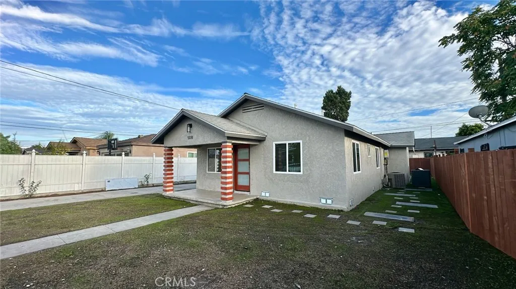 508 West Pear Street Compton, CA 90222 - Photo 4 of 14 a house with green field in front of it