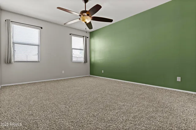 a bed room with a bed and a chandelier