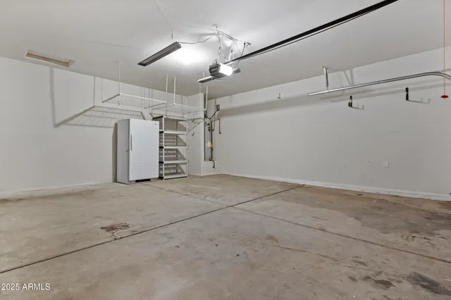 a backyard of a house with basket ball court and trampoline