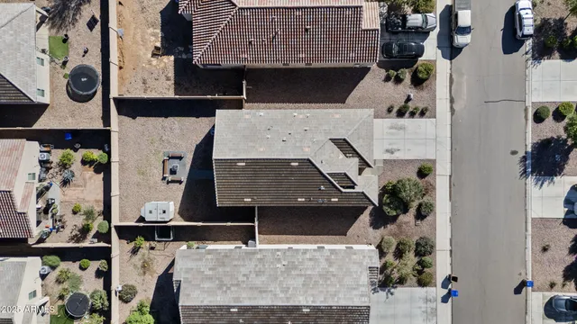 a view of a house with entertaining space and a street sign