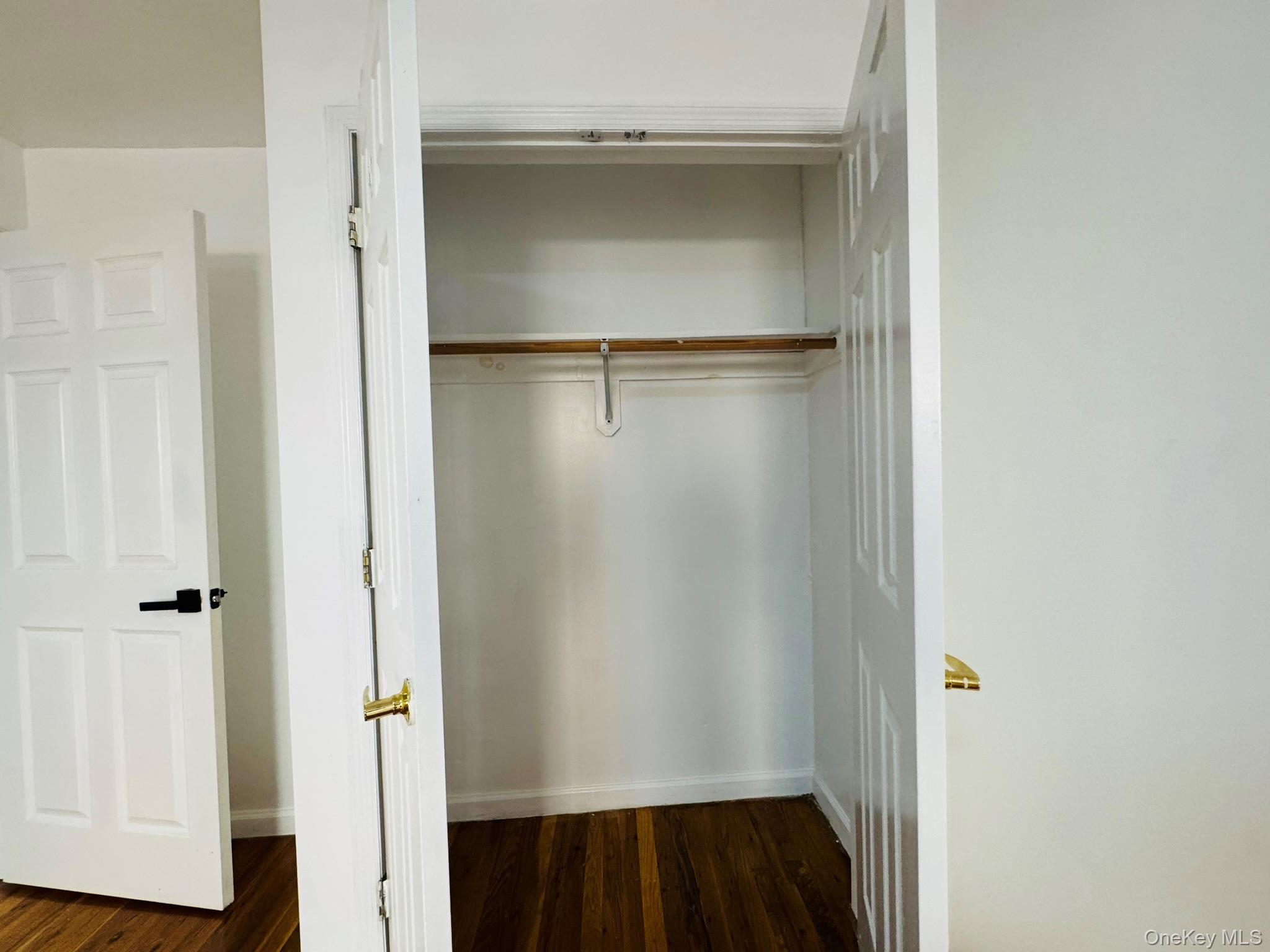 53 West 192nd Street, Unit 3A Bronx, NY 10468 - Photo 11 of 14 a view of a room with wooden floor and closet