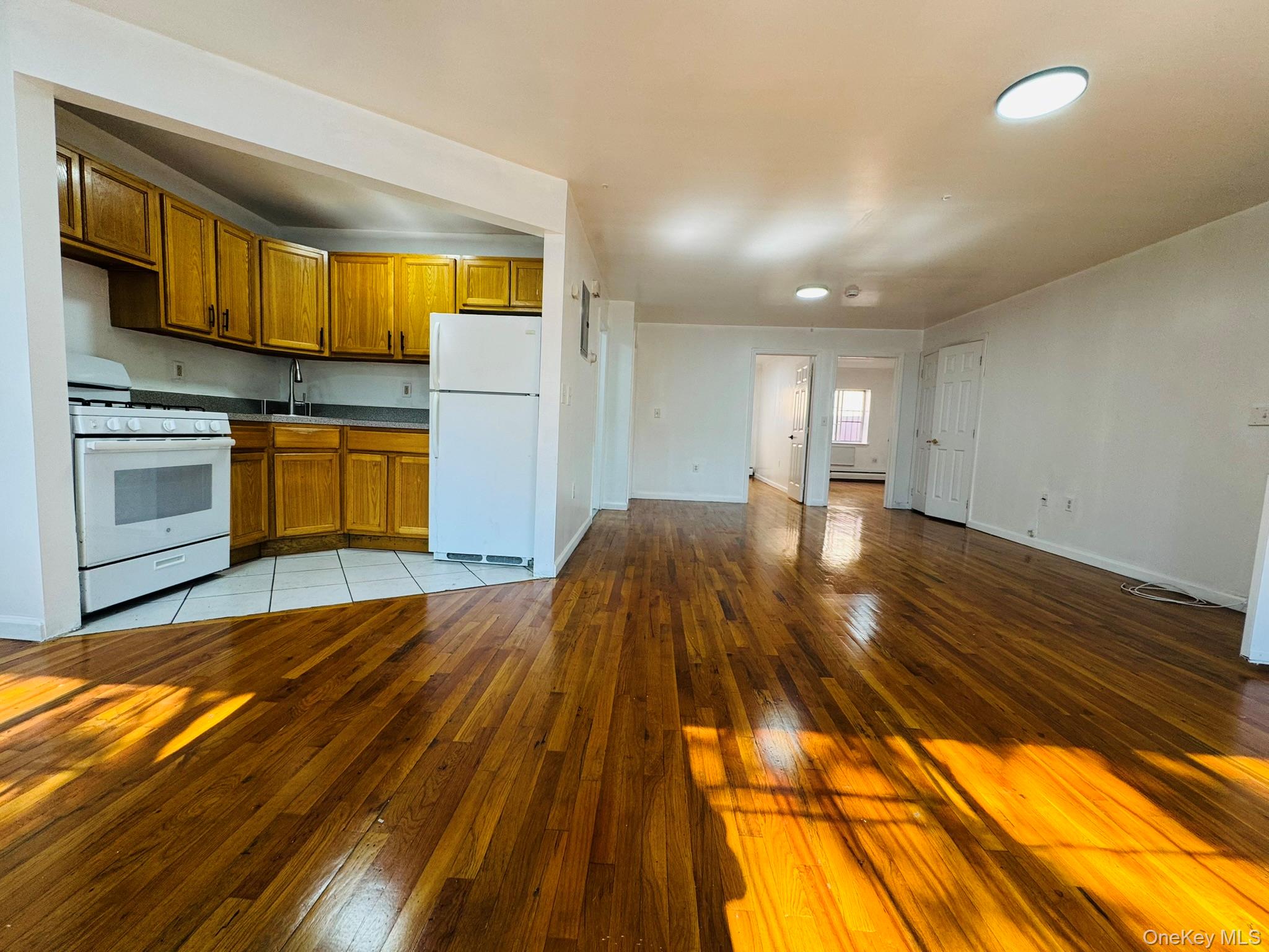53 West 192nd Street, Unit 3A Bronx, NY 10468 - Photo 14 of 14 a view of an empty room and kitchen