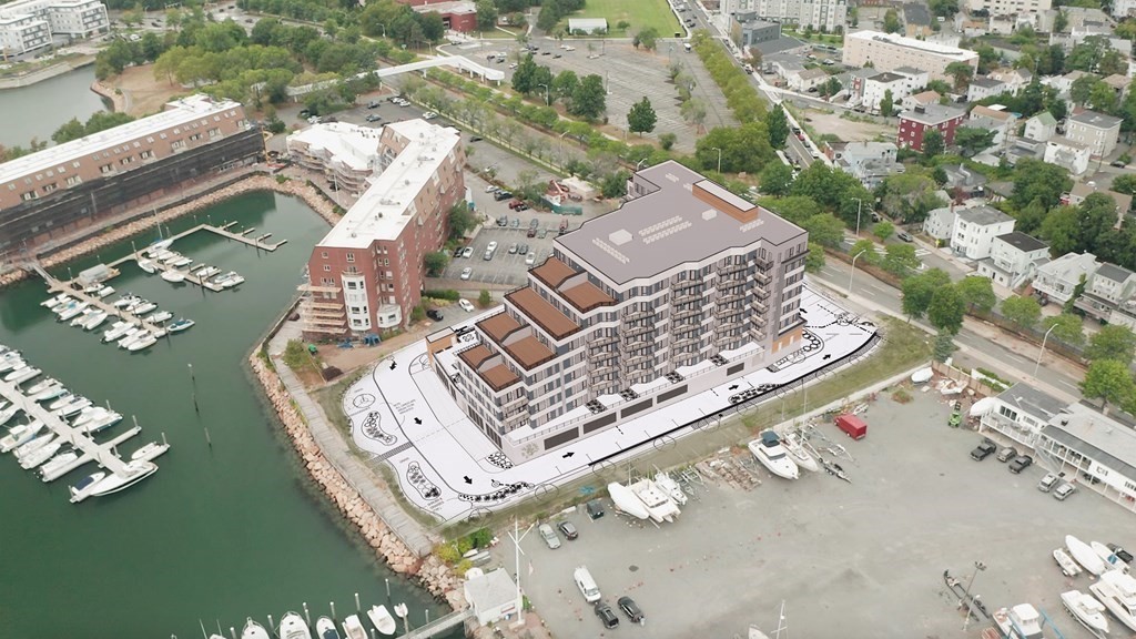 98 Lynnway, Unit 102 Lynn, MA 01902 - Photo 2 of 5 an aerial view of a residential apartment building with a garden