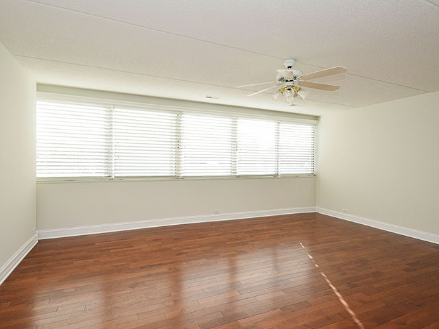 1724 Seton Road Northbrook, IL 60062 - Photo 14 of 19 an empty room with wooden floor and windows
