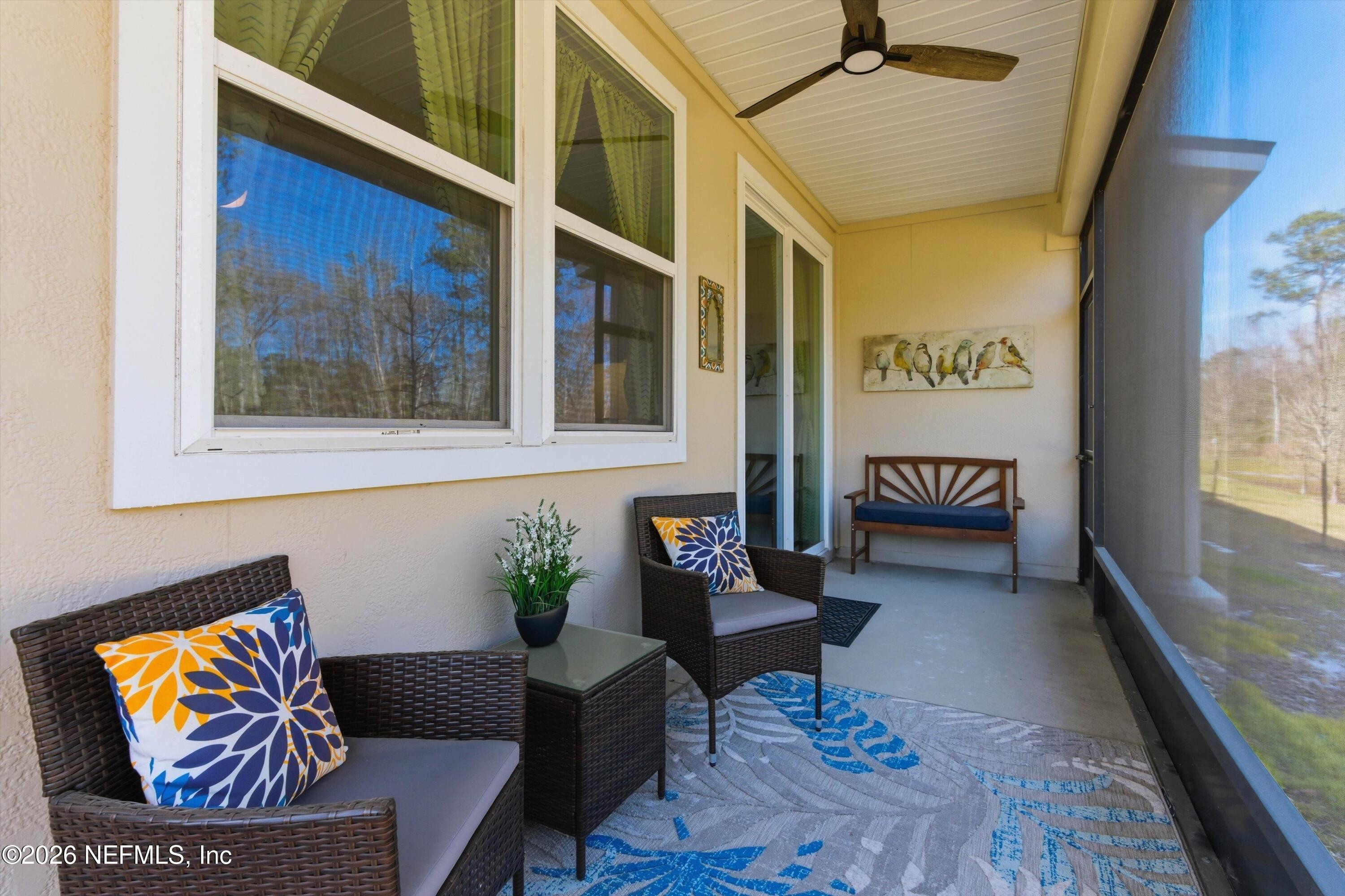 103 Seaport Breeze Road St. Augustine, FL 32095 - Photo 5 of 44 a living room with furniture and a rug