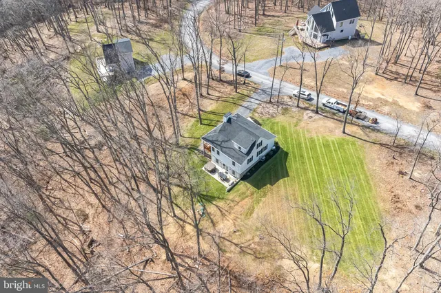 a view of a swimming pool with a yard