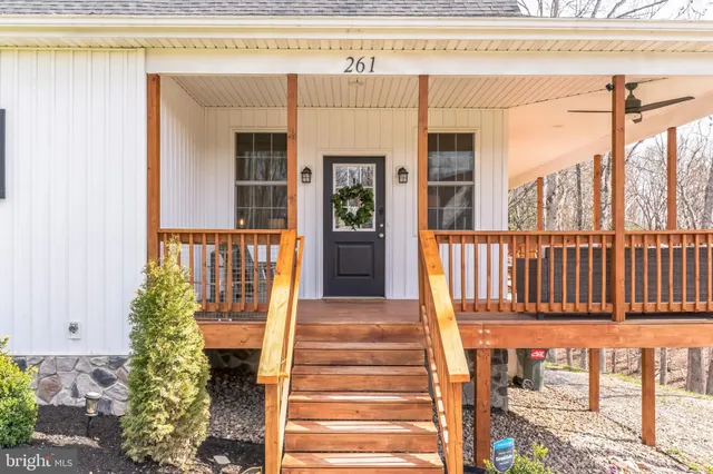 a front view of a house with a porch